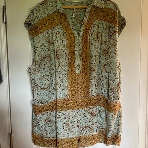 This is a free people romper. It is sleeveless!